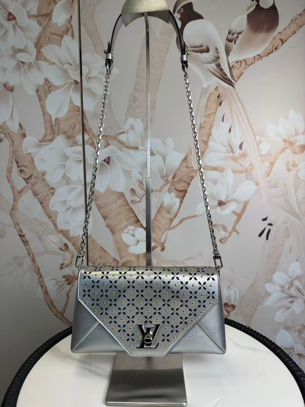 Louis Vuitton Perforated Studs Love Note Clutch